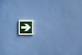 white and green arrow sign