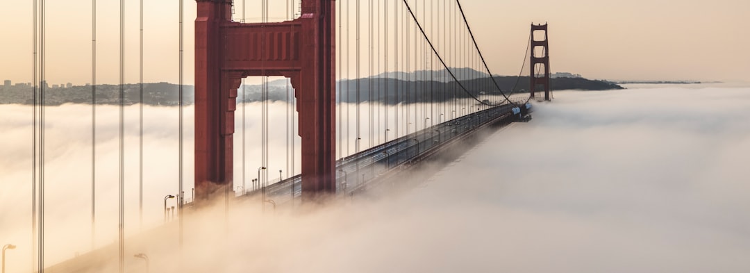 red bridge under white sky