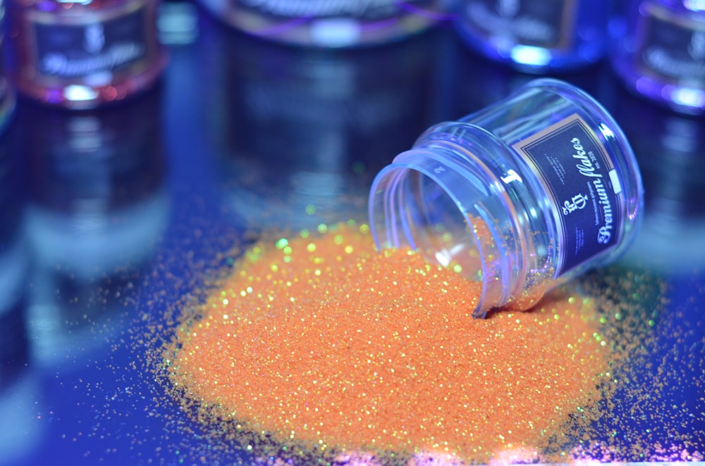 orange beads in clear plastic container