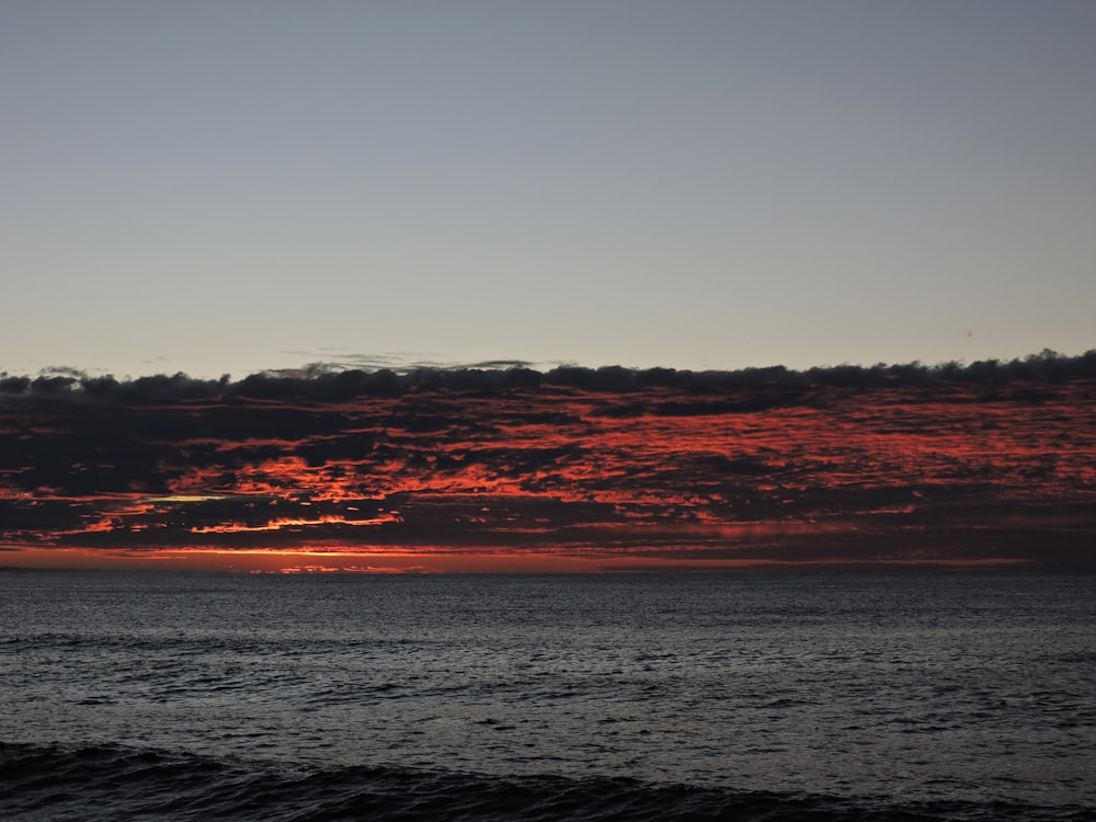 body of water during sunset