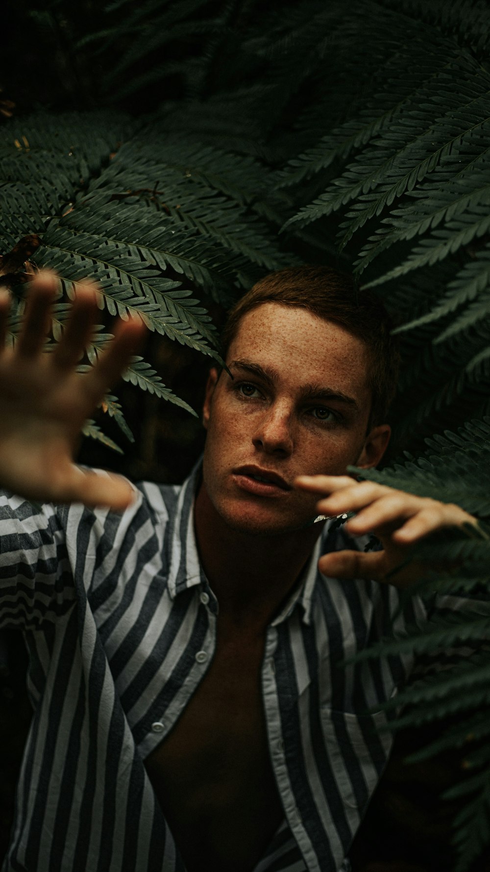 man in black and white stripe dress shirt