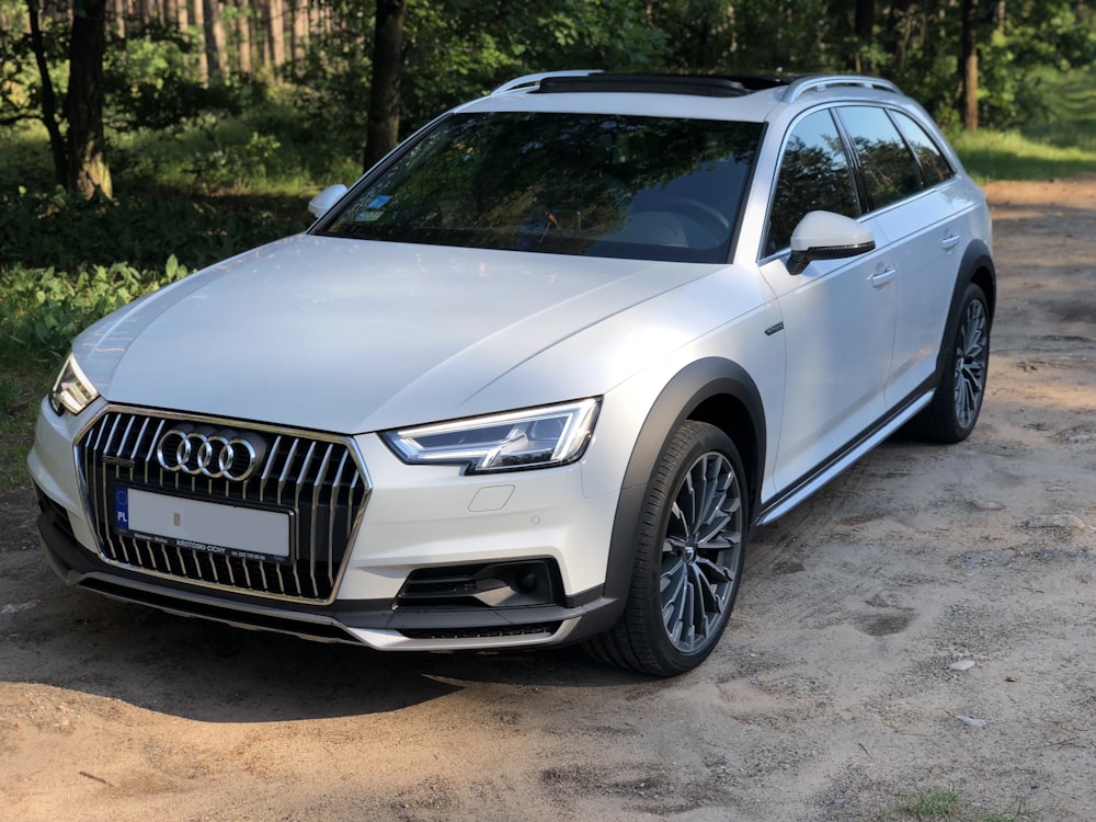 black audi coupe parked on gray concrete pavement during daytime