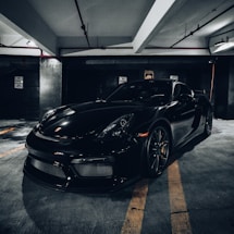 black porsche 911 parked in garage