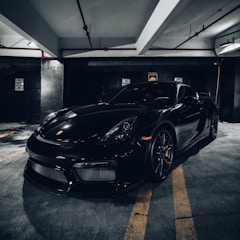 black porsche 911 parked in garage