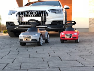 black and red car parked on gray pavement