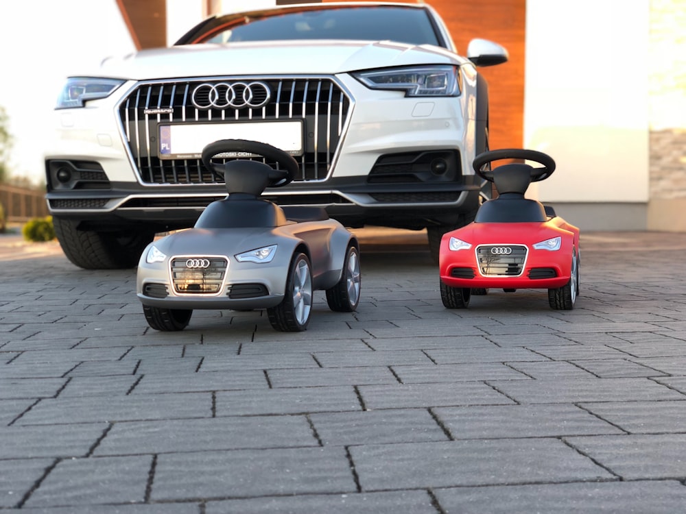 black and red car parked on gray pavement