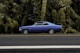 blue coupe on gray asphalt road during daytime