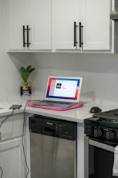 macbook air on white table