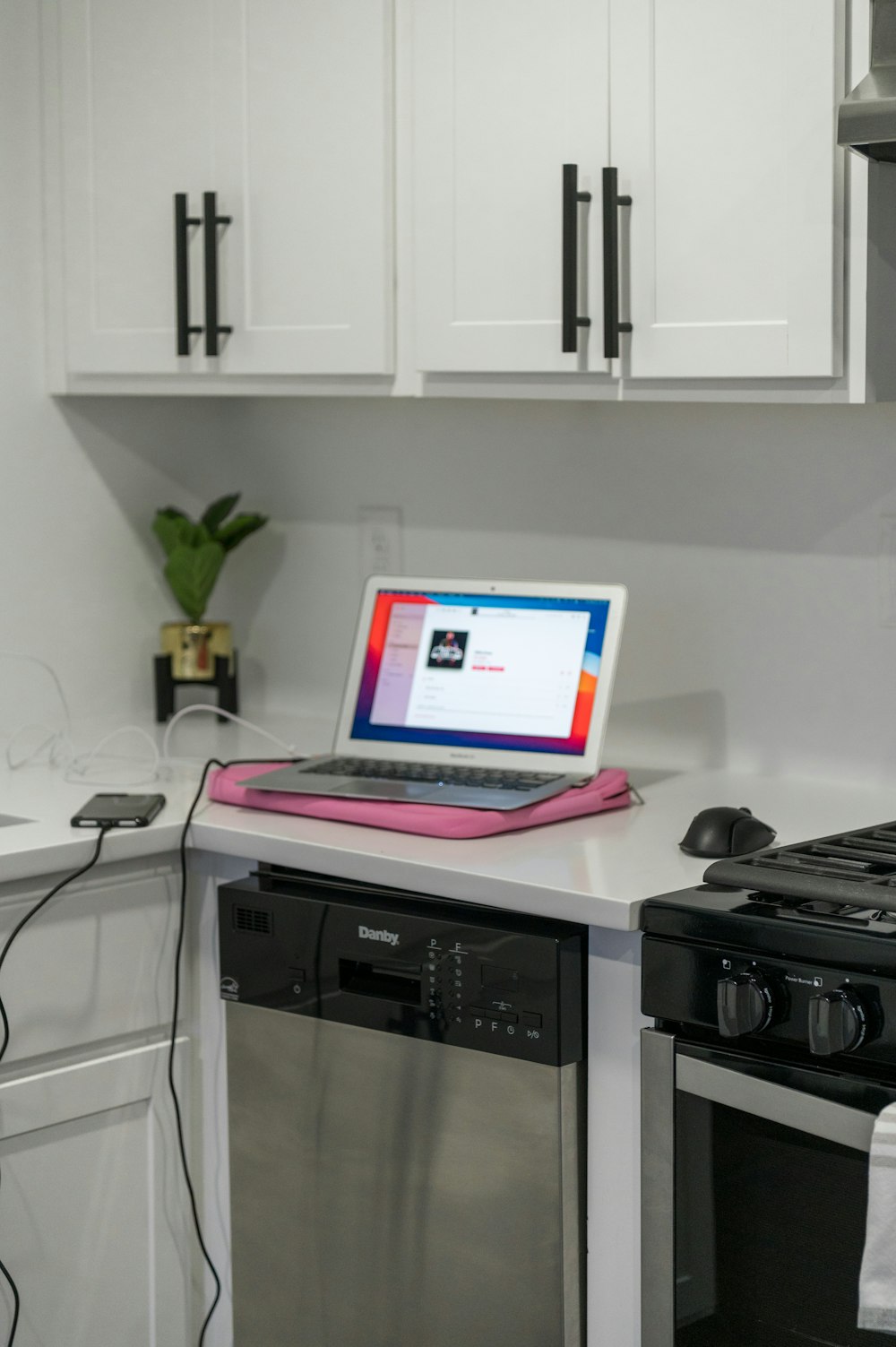 macbook air on white table