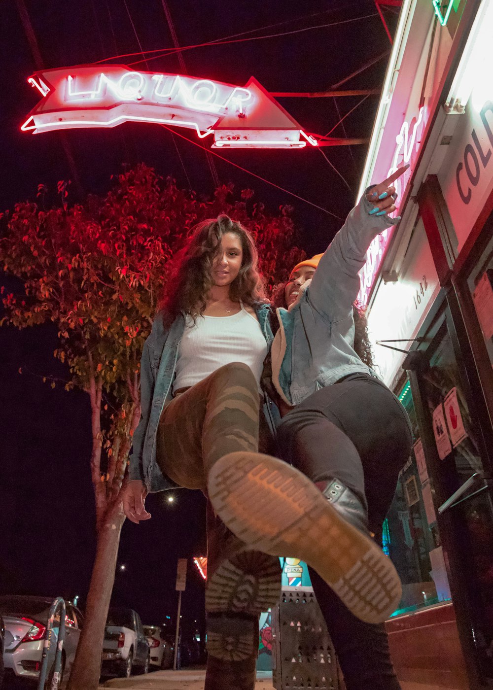 woman in white long sleeve shirt and black pants sitting on brown wooden chair