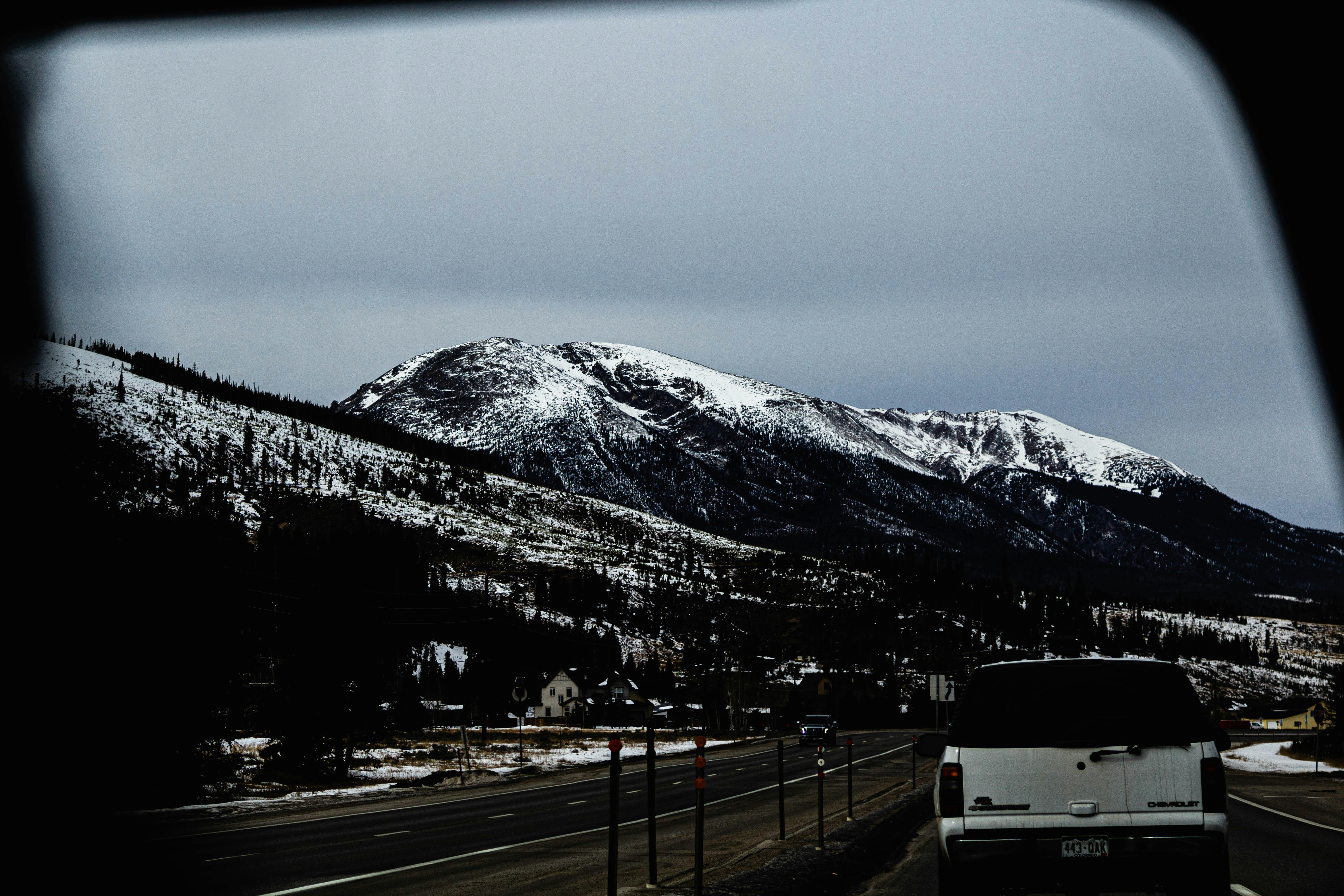 white and black mountain under white sky during daytime