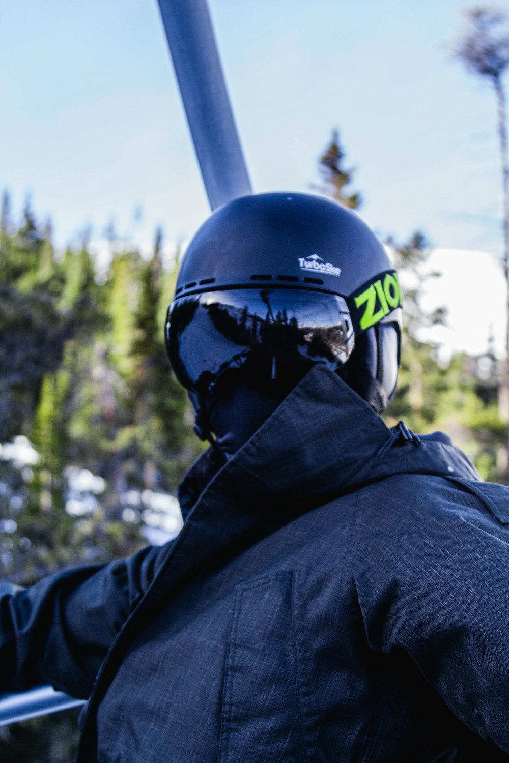 man in blue helmet and black jacket