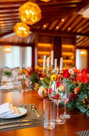 red roses in clear glass vase on table