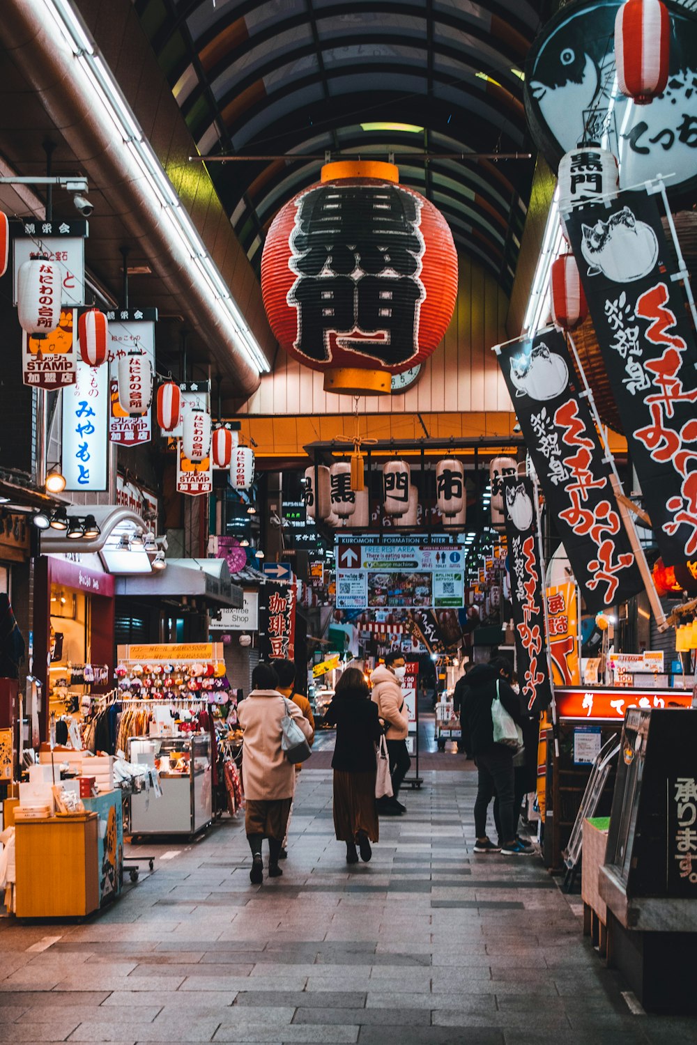 people walking on street during nighttime