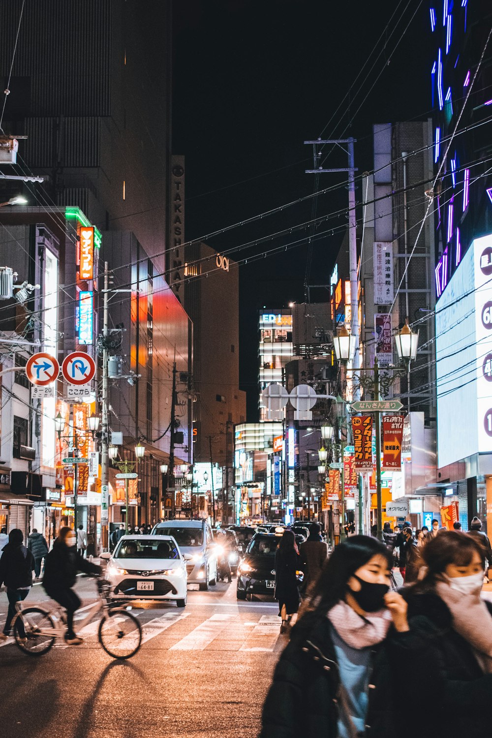 people walking on street during night time