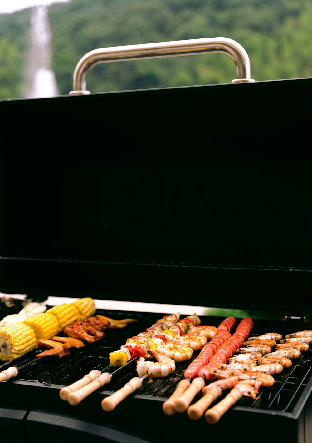 grilled corn on black metal grill