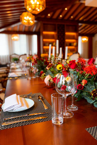 red roses on clear glass vase