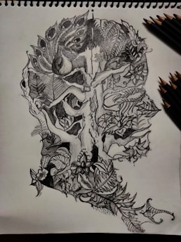 A delicate fine-line tattoo design featuring mystical nature elements in black and white.