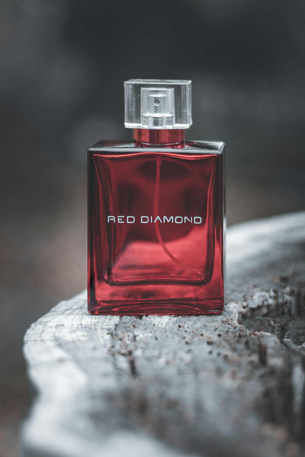 red and black perfume bottle