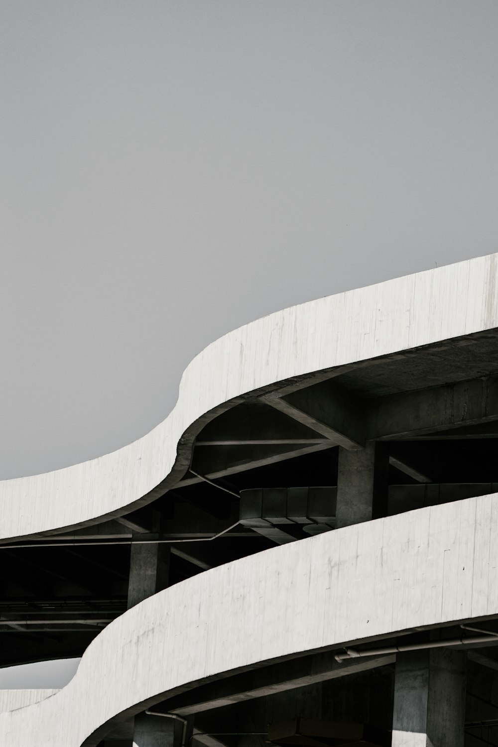 white concrete building under white sky during daytime