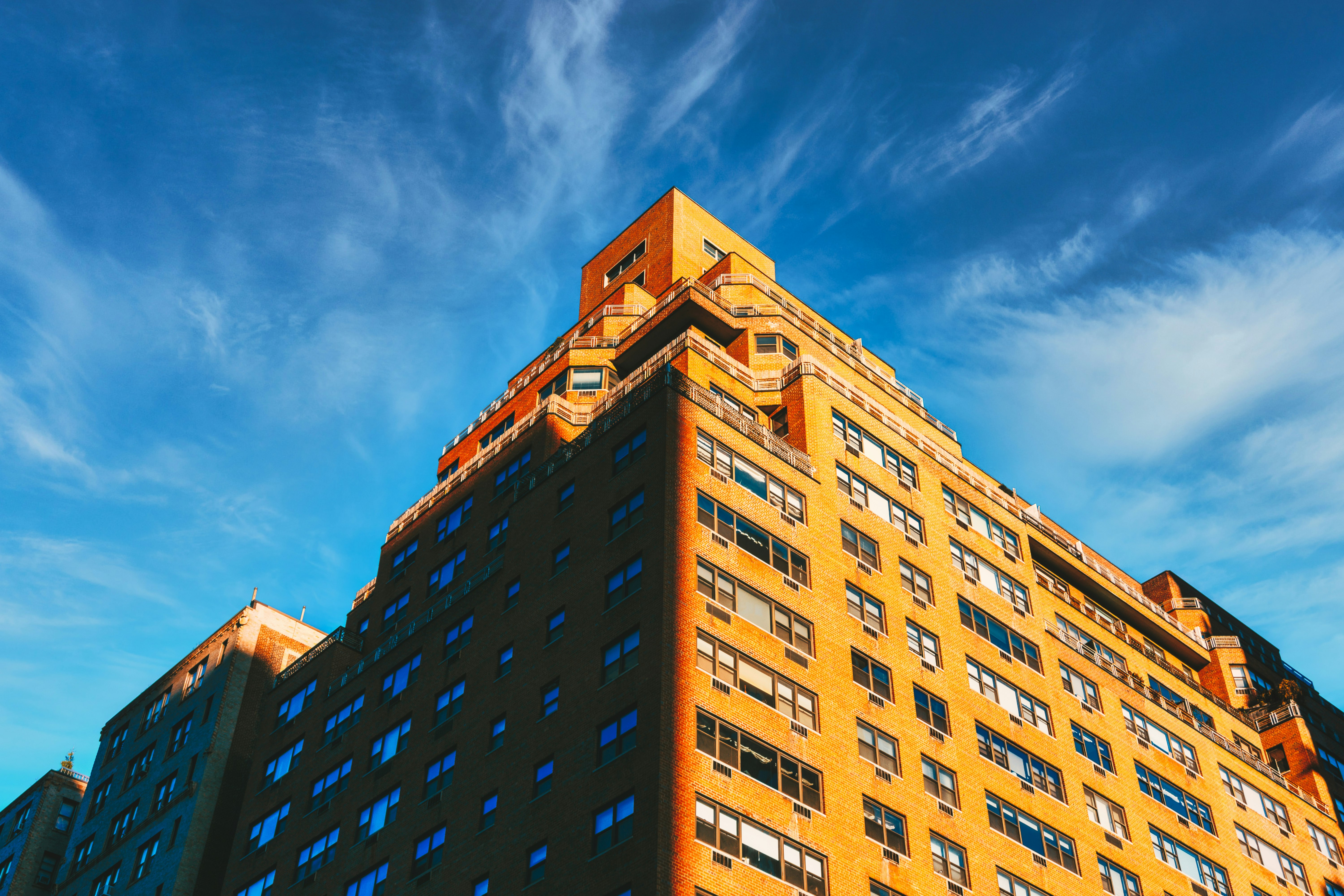 brown concrete building under blue sky during daytime