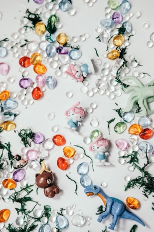 Close-up of Playmobil mini figures and accessories laid out neatly on a table.