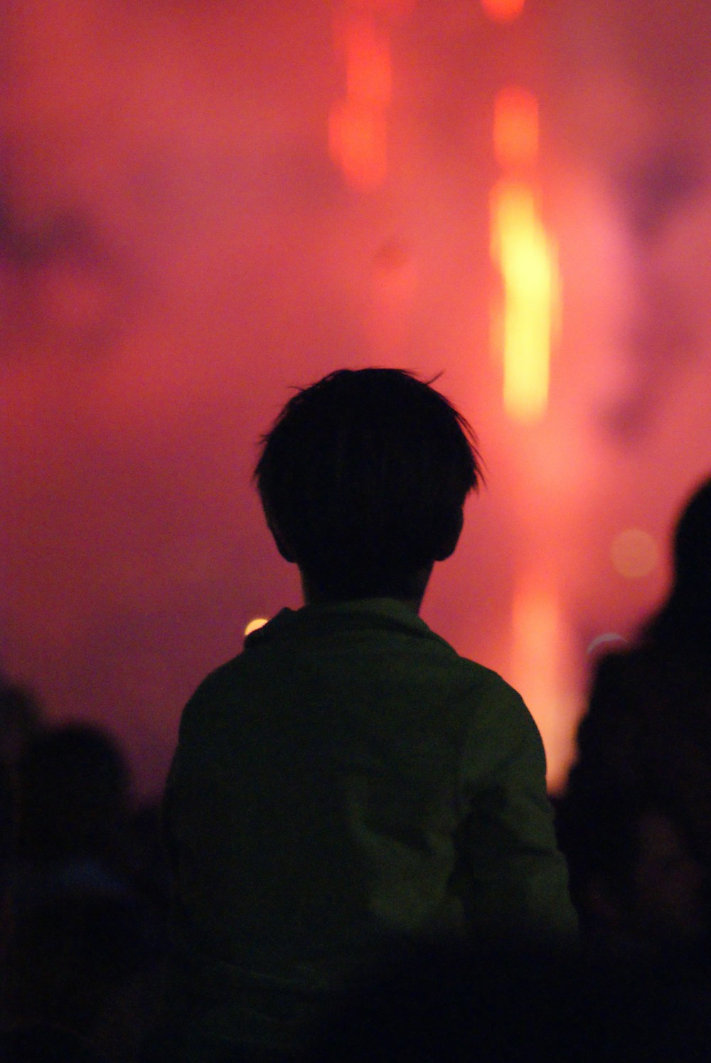 silhouette of people standing during night time