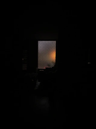 A softly lit, intimate virtual room from Second Life with subtle shadows and warm tones.
