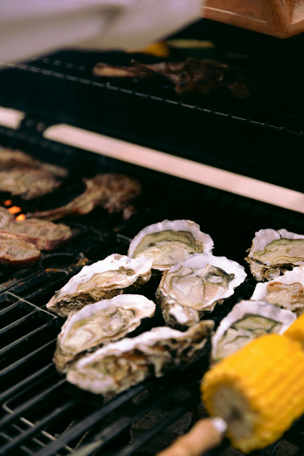 white and brown mushrooms on black grill