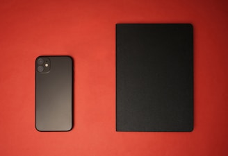 black iphone 7 on red textile