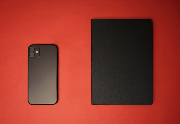 black iphone 7 on red textile