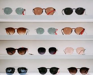 black framed sunglasses on white surface