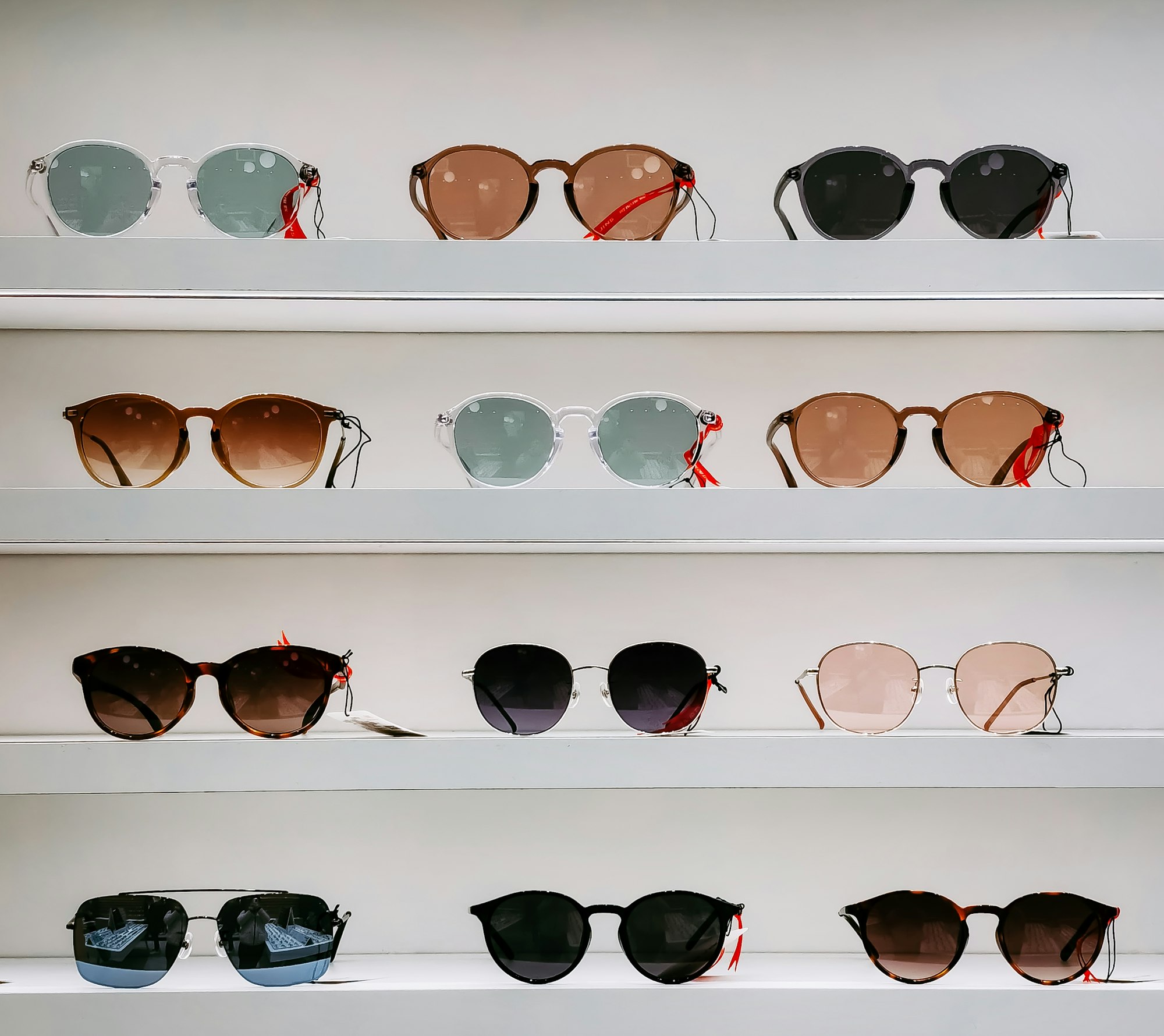 black framed sunglasses on white surface