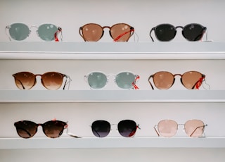 black framed sunglasses on white surface