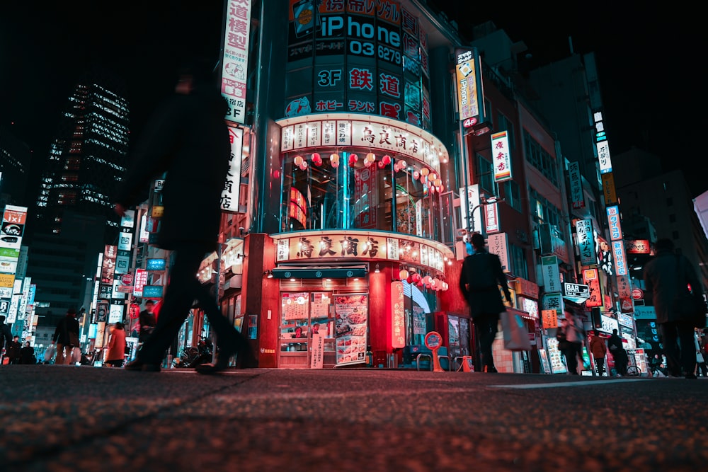 people walking on street during night time