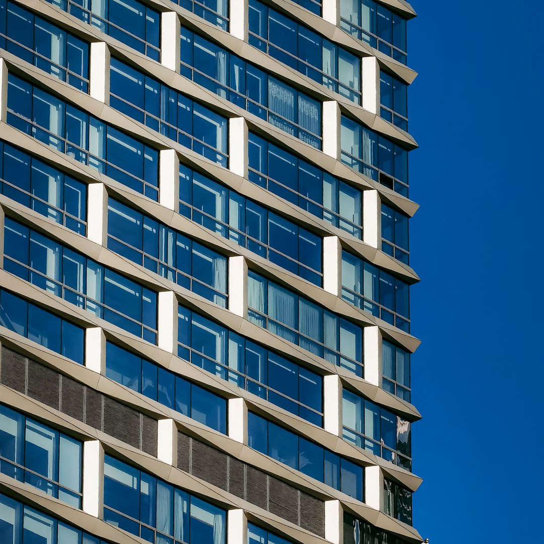 white and blue concrete building under blue sky during daytime