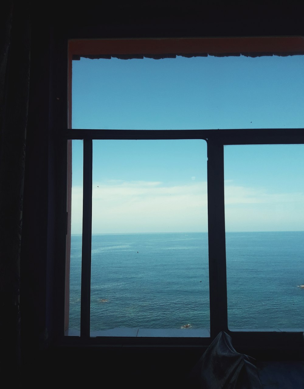 blue sea under blue sky during daytime