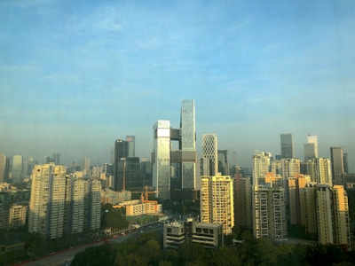 City skyline featuring high-rise business towers during daytime.