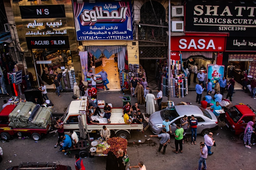 A vibrant market scene in Al-Mazar Al-Shamali with locals engaging in daily trade.
