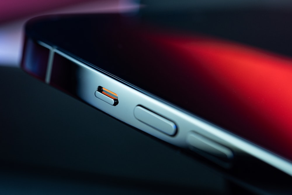 silver iphone 6 on red surface
