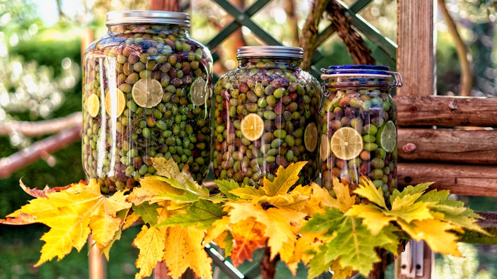 green and yellow leaves in clear glass jar