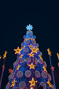 blue and red christmas tree with string lights