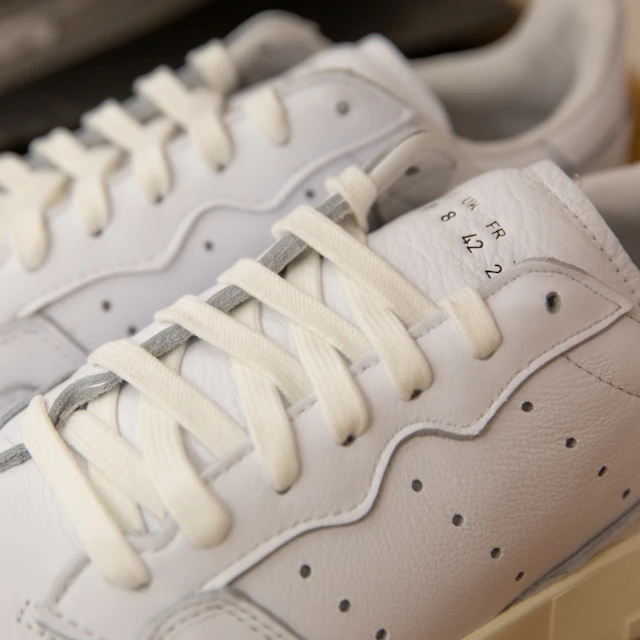 A pair of white Nike Air Force 1 shoes