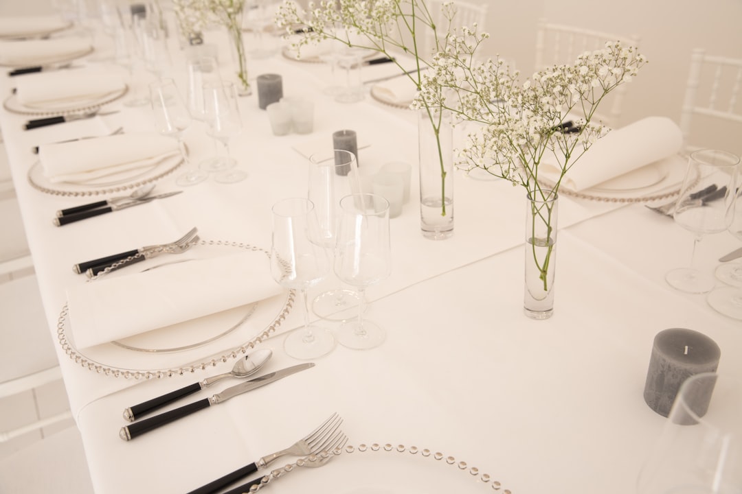 silver fork and bread knife on white ceramic plate