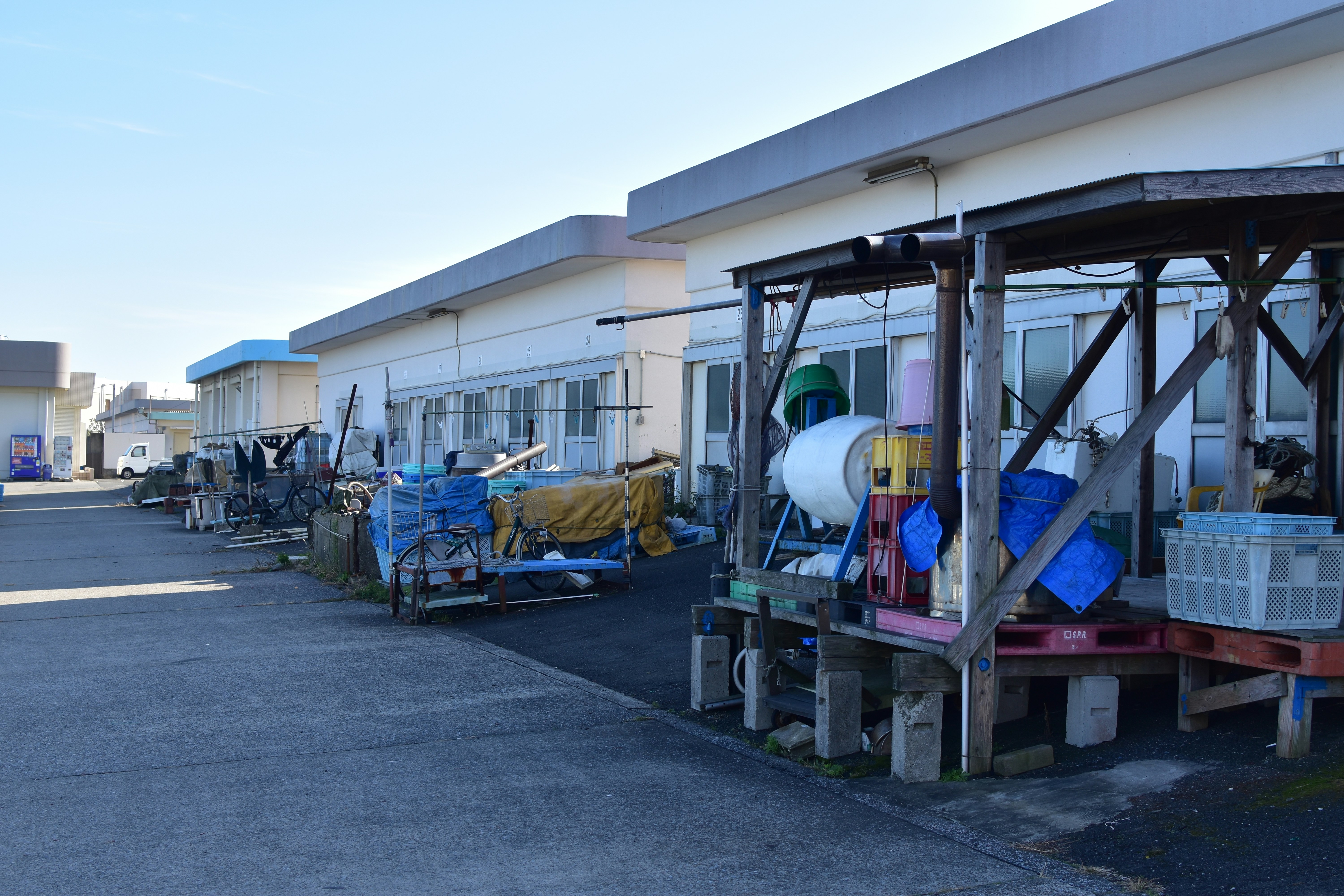 white and blue water jug on brown wooden table