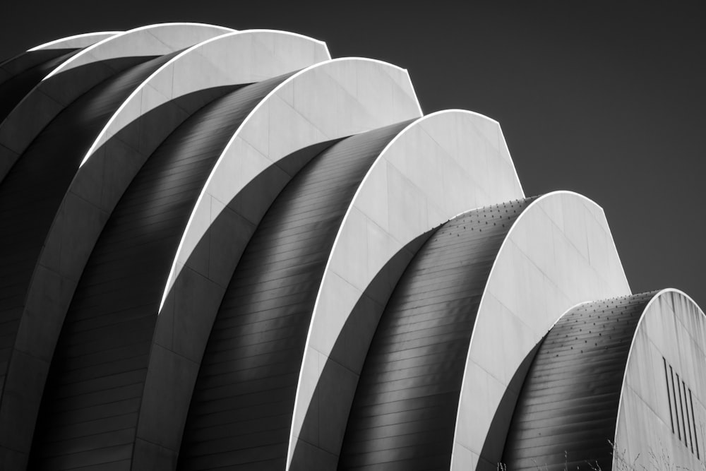 white spiral stairs in grayscale photography