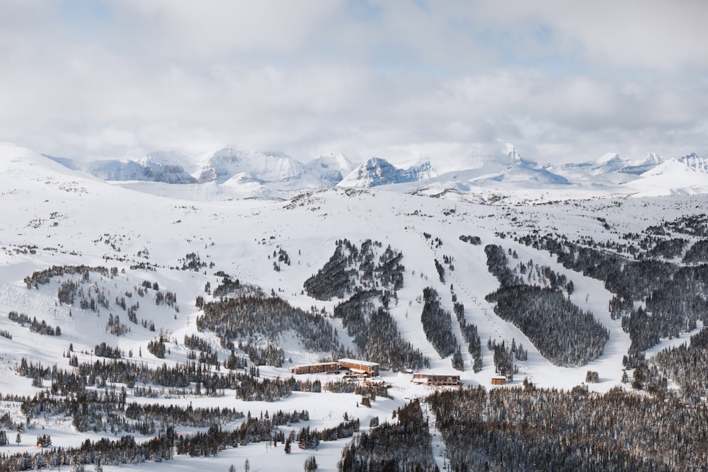 snow covered mountain under cloudy sky during daytime