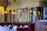 Cozy interior of the bistro with art nouveau lighting and elegant burgundy accents.