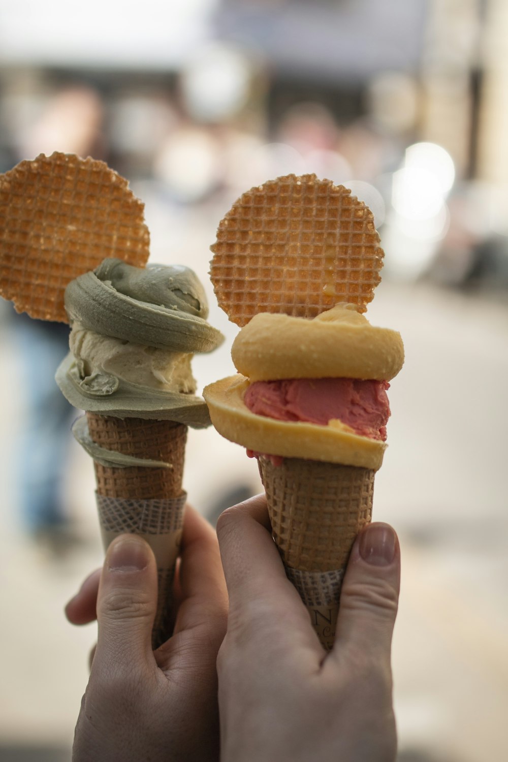 person holding ice cream cone