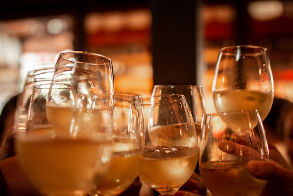 clear wine glasses with brown liquid